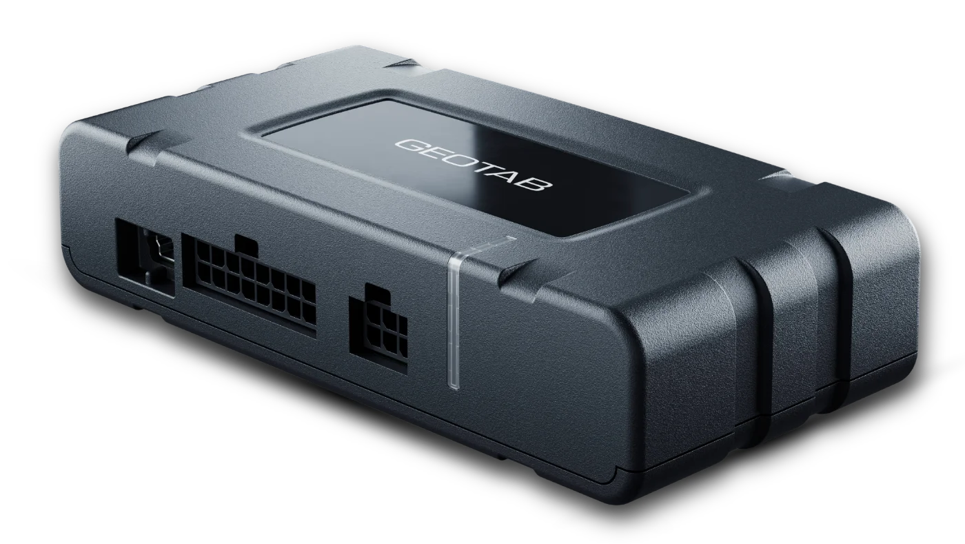 Geotab GO telematics device up close, with vehicle connector, expansion port, and status light visible