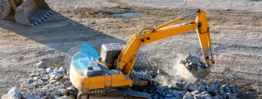 Excavator loading rock on a construction site