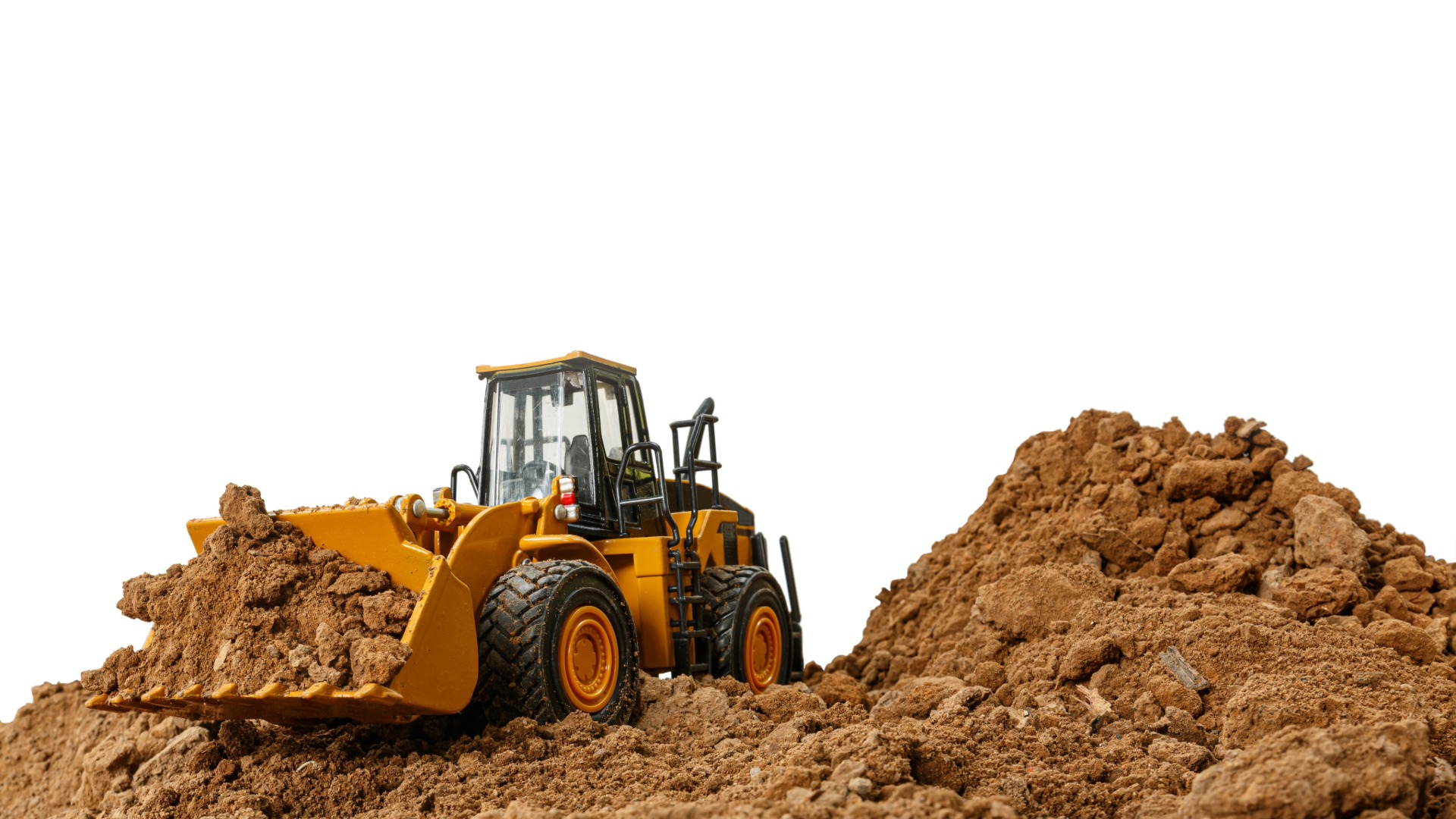 Wheel loader working a dirt pile with a maintenance widget pinned to its cab