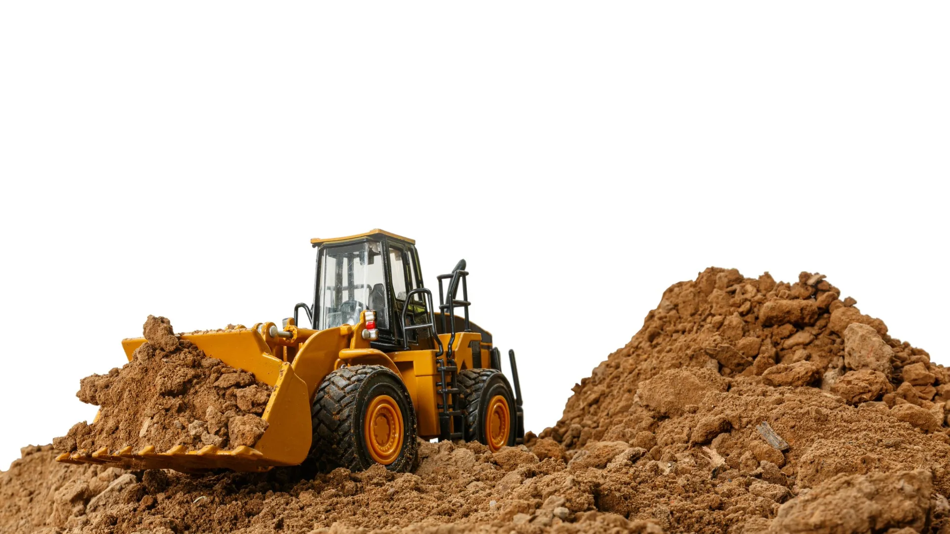 Wheel loader working a dirt pile with a maintenance widget pinned to its cab